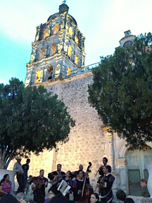 [Alamos Estudiantina in concert at dusk on the steps of the Alamos Church on the Plaza: 201k]