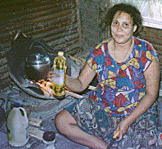 [Barbara Smak preparing dinner in a Chambri fireplace pot: 28k]