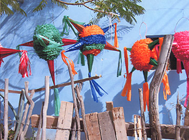 5-pointed red, blue, green and organd pinatas for sale in an Alamos, Sonora, Mexico barrio