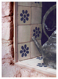 [Fixed glass pane set between mud brick and Mexican tile: 38k]
