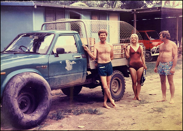 [Frank Patania, Carolyn Leigh, Bob Hayward with green pickup truck named Clem on Peter Johnson's banis, Wewak, ESP, PNG: 279k]